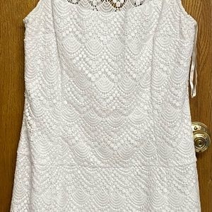 White lace dress with sheer top. To the kneecap.